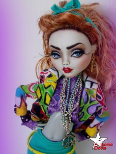 a close up of a doll with pink hair and blue eyes wearing a peace sign necklace