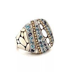 Authentic and beautiful by John Hardy from his Kali Collection. This large cushion top ring is crafted from sterling silver with 18k yellow gold accent. The top has 7 long strips, the strips alternate with gemstones, yellow gold beads and sterling silver oval pebble design.  The wide shank has more oval pebbles and the wide shank blends to a slim polished band round the back of the ring. It has the designer hallmark with the gold content.    Brand:   John Hardy   Hallmark: JH 18k 925  Gemstone: Pebble Design, Gold Cushions, Cushion Ring, Top Rings, John Hardy, 18k Yellow Gold Ring, Yellow Gold Ring, Gold Beads, Gold Accents