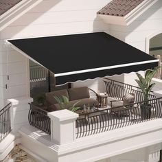 an awning over a patio area with furniture and plants on the balconies