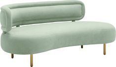 a light green couch sitting on top of a wooden leg rester with two legs