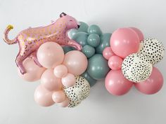 balloons are arranged in the shape of animals and leopards