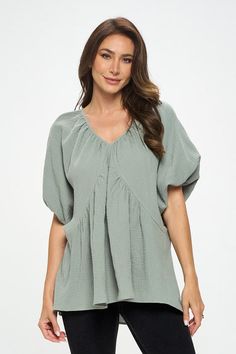 Made in USA Cotton V neck Puff Sleeve Tunic Top. Fabric content: 100% Cotton. Available in other colors. Style: casual, formal Print / Pattern: solids Silhouette: oversized Fit: oversized Neck Line: v neck Sleeve: shortsleeve Lining: no Made In: Made in U.S.AFabric Contents: 100% Cotton.Size Measurement (inch): S: 18.5 (Bust), 21.0 (Waist), 27.0 (Hips), 28.0 (Length) M: 19.5 (Bust), 22.0 (Waist), 28.0 (Hips), 28.5 (Length) L: 20.5 (Bust), 23.0 (Waist), 29.0 (Hips), 29.0 (Length) Casual Billowy V-neck Tops, Versatile Spring Blouse In Solid Color, Versatile Blouse For Spring, Billowy Casual Tops For Workwear, Billowy Solid Color Summer Tops, Oversized Puff Sleeve Top For Work, Solid Billowy Tops For Summer, Chic Relaxed Fit Top With Balloon Sleeves, Chic Balloon Sleeve Top With Relaxed Fit