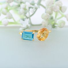 Swiss Blue Topaz & Citrine Ring 14K Yellow Gold Ring- Engagement Ring, Promise Ring, November Birthstone, Anniversary Birthday Gift For Her Whether for an anniversary or birthday, this elegant ring is sure to be a cherished gift for any woman. This 14K yellow gold ring features Swiss Blue Topaz and Citrine gemstones, making it a stunning choice for an engagement or promise ring. Gemstone Details :- - Gemstone: Topaz - Stone Type: Lab Created - Shape: Baguette Cut - Size: 8x6 MM - Color: Blue  - Aquamarine And Citrine Ring, Yellow Gold Multi-stone Topaz Ring Gift, Anniversary Topaz Birthstone Gemstones, Yellow Topaz Birthstone Ring Gift, Yellow Gold Topaz Birthstone Ring For Gift, Yellow Gold Topaz Birthstone Ring As Gift, Yellow Gold Topaz Ring Gift, Anniversary Multi-stone Citrine Topaz Ring, Topaz Birthstone Ring With Gemstone Accents For Gift