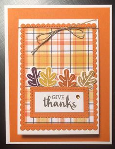 an orange and white card with the words give thanks