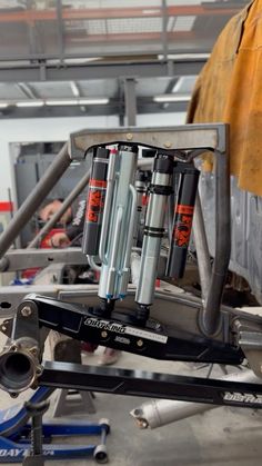 the front suspensions on a car being worked on