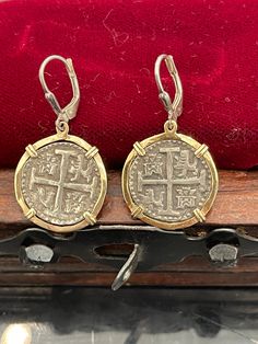 Atocha coin dangle earrings in 14kt solid gold bezel. These are absolutely beautiful earrings handmade from atocha silver bars and it comes with the certificate Silver Round Byzantine Earrings, Gold Coin Pendant Earrings, Handmade Silver 14k Gold Earrings, Handmade 14k Gold Silver Earrings, Coin Pendant Medallion Earrings For Gift, Silver Byzantine Jewelry In 14k Gold, Coin Pendant Earrings For Gifts, Coin Pendant Earrings As Gift, Silver Coin Pendant Earrings For Gift