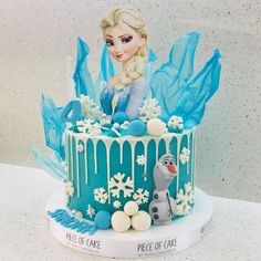 a frozen princess cake with frosting and decorations