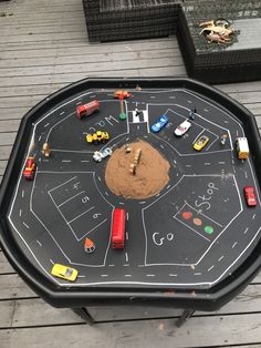 a table with cars and trucks on it