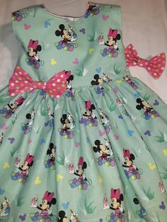 Minnie Mouse Easter Dress Very Limited Fabric - can not re order - enough fabric to make only 1 dress - Adorable Easter Minnie Mouse Spring Summer Dress All little girls will love being the center of attention in this beautiful handmade dress Great for Easter -Photo Shoot - Birthday Party-Play Date or any Special Occasion Little Girls Baby Toddler Dress This will be made and ready within 3 days of order **SIZES Available -6 mo. to 2yr. Very Limited supply on this Fabric-- Bodice is fully lined i Playful Minnie Mouse Summer Dress, Playful Fitted Minnie Mouse Dress, Playful Minnie Mouse Fitted Dress, Minnie Mouse Fitted Sleeveless Dress, Minnie Mouse Sleeveless Fitted Dress, Fitted Sleeveless Dress For First Birthday, Playful Sleeveless Dress With Bow, Playful Minnie Mouse Dress-up Dress, Playful Minnie Mouse Dress For Dress-up