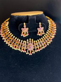 Description: This yellow gold color CZ necklace and matching earrings are lightweight and made with the highest quality craftsmanship. They are a stunning addition to any outfit and will make a perfect gift for any occasion. Features: Crystal stones Lightweight and elegant Can be paired with any dress, kurti, or saree Material: Cubic Zirconia (CZ) Stones Solitaire Necklace Ready to ship from California Free US standard shipping Ready to ship CARE INSTRUCTIONS: 1) Please keep your Jewelry away fr Yellow Temple Jewelry For Puja, Dual-tone Gold Jewelry For Diwali, Yellow Gold Plated Jewelry For Diwali, Elegant Yellow Jewelry For Puja, Dual-tone Gold Temple Jewelry, Dual-tone Gold Jewelry Sets For Gifts, Gold Dual-tone Jewelry Sets As Gift, Diwali Gold Plated Temple Jewelry, Gold Plated Temple Jewelry For Diwali