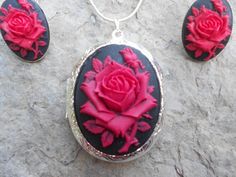 For sale are perfectly detailed, flawless (red rose with a single bud on a black background) cameo pendant silver plated LOCKETS!!!! Gorgeous!!! About 1 3/4" long!!! They hold two photos inside (or keepsakes). The French Earrings are also silver plated, about 1" long and very nice quality!!  They are offered at a reasonable price, make perfect gifts, and are wonderful quality!!!!  and the chain is 22" .925 silver plated 1.2mm snake chain, with a lobster claw clasp!!!! Please do visit my shop!!!