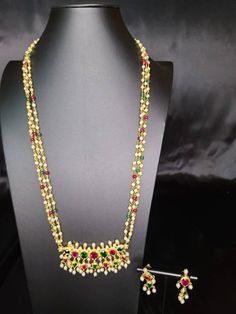 "DESIGN 1 : Sitpushpa Tanmani with beautiful multicolour motimala 30 inch. Its Micro gold polished with setting stone Premium quality DESIGN 2: \"Suryashobha Tanmani\" necklace with beautiful extension of mohanmala. It's micropolished with setting stone. Length is 30 inch DESIGN 3 . multicolor pink pearl necklace with tanmani" Multicolor Stone Work Necklace For Rituals, Multicolor Kundan Necklace For Rituals And Festive Occasions, Traditional Multi-stone Temple Necklace For Festivals, Festive Bollywood Style Multicolor Mala, Bollywood Style Multicolor Festive Mala, Heavy Multicolor Necklaces For Puja, Temple Jewelry Multi-stone Necklace For Festivals, Festival Multi-stone Temple Necklace, Festive Multi-stone Temple Necklace