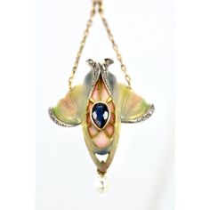 This Art Nouveau Pendant is special.  It is enameled in colors of Blue, Green, Pink and Cream. It also has a Pear shaped Blue Sapphire in the center and single cut Diamonds surround.  This shape is reminiscent of a tulip and it ends with a small natural pearl.  There is also another pearl that pulls the chain in the center.  This piece comes out of Great Britain and is lovely.  Art Nouveau necklaces are in great demand because there are few left.  This was done at the height of Art Nouveau jewelry my photos do not do it justice but we can only do the best we can.  This is priced to sell so do not wait, it will be gone. Elegant Teardrop Enamel Jewelry, Art Deco Hallmarked Enamel Jewelry, Elegant Yellow Gold Jewelry With Artistic Design, Art Deco Enamel Jewelry For Formal Occasions, Artistic Enamel Jewelry For Formal Occasions, Elegant Enamel Jewelry With Gemstone, Luxury Enamel Inlaid Jewelry, Elegant Blue Enamel Jewelry, Elegant Enamel Jewelry With Cabochon