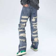 These American Heavy Distressed Jeans are the ultimate blend of style and comfort. With a unique distressed design, these jeans are perfect for making a statement. Crafted with premium materials, they offer lasting durability and a comfortable fit. Elevate your fashion game with these must-have jeans! Features: -80% Cotton, 20% Spandex -Mid-rise waist -Premium denim fabric -Pure -Regular fit -High Street style Urban Style Distressed Denim Blue Flare Jeans, Ripped Washed Blue Jeans For Fall, Urban Denim Blue Distressed Flare Jeans, Urban Distressed Denim Blue Flare Jeans, Distressed Blue Flare Jeans For Streetwear, Casual Distressed Dark Wash Pants, Urban Distressed Medium Wash Jeans, Ripped Dark Wash Jeans For Streetwear, Urban Style Ripped Denim Jeans