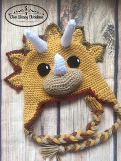 a crocheted animal hat with horns on it