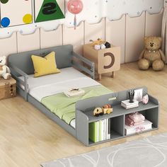 a child's bedroom with a bed, bookcase and toys on the floor