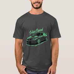 a man standing in front of a gray t - shirt with an image of a car