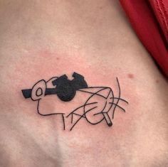 a woman's stomach with a tattoo on it that has a black and white image of a cow