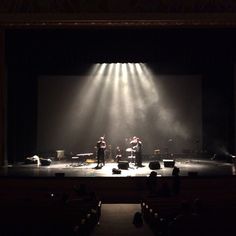 a group of people standing on top of a stage