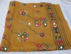 Pattern - embroidered sequin scarf. Ideal for - women/ girls. Occasion - formal or casual. Fabric - cotton. It has an embroidered floral pattern all over. This piece is from the Kutchh area of Gujarat. It is hand-painted and embroidered. Color - On a light yellow background, embroidery is done with different colored threads and mirror sequins. Plastic sequins are used because they are lightweight. Size - 40 x 84 inches(approx). Care - gentle hand wash. For more such scarves please visit- https:/ Yellow Cotton Dupatta For Summer, Beige Cotton Dupatta For Festivals, Summer Cotton Dupatta With Multicolor Embroidery, Multicolor Embroidered Cotton Dupatta For Summer, Cotton Dupatta With Handwork For Festivals, Yellow Embroidered Dupatta For Festival, Yellow Cotton Dupatta For Festivals, Handmade Cotton Dupatta, Multicolor Cotton Dupatta With Embroidered Border