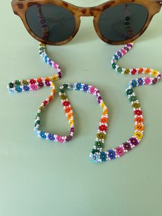 Designed to add a pop of color to your style, this handmade glasses chain features eye-catching beads in vibrant rainbow hues. Combining fashion and functionality, this elegant accessory helps you carry your glasses without the worry of misplacing them. Carefully crafted using lightweight and durable materials, each piece is handmade with a unique touch, ensuring a distinctive design. Perfect for completing your daily look, this glasses chain is a stylish choice. If you have any customization re Multicolor Adjustable Chain Glasses Chains For Fashion, Trendy Multicolor Summer Glasses Chains, Summer Glasses Chains With Colorful Beads As Gift, Colorful Beads Glasses Chains As Summer Gift, Gift Glasses Chains With Colorful Glass Beads, Glass Glasses Chains With Colorful Beads For Gifts, Gift Colorful Glass Beads Glasses Chains, Trendy Colorful Beaded Glasses Chains Gift, Multicolor Beaded Chain Glasses Chains For Fashion