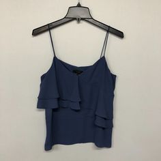 This Listing Is For A - Nwt J. Crew Women Sleeveless Top Drapey Ruffle Cami Tank Size 6 Blue Condition: New With Tags See Pictures For Measurements & Any Additional Material Details. Blue Sleeveless Ruffled Tops, Casual Blue Ruffled Tank Top, Sleeveless Blue Tops For Layering, Blue Camisole Vest For Summer, Chic Blue Camisole Tank Top, Sleeveless Ruffled Top For Layering, Chic Blue Tank Vest, Blue Ruffled Tank Top, Blue Ruffled Straps Top