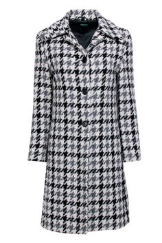 Conquer chilly weather in style with this cozy-chic Benetton coat. Its luxe wool blend fabric is elevated by a timeless cream, grey, and black houndstooth pattern. A point collar and button front closure give it a sophisticated feel. Add a layer of warmth and style to any outfit with ease with this polished piece. Size 6 (IT 42) 70% Wool, 30% Polyamide Lining 100% Viscose Button front closure Point collar Side pockets Bust 36" Waist 34" Shoulder to hem 37" Sleeve length 22.5" Shoulder to shoulder 15.5" Elegant Winter Houndstooth Outerwear, Classic Houndstooth Winter Outerwear, Classic Winter Houndstooth Outerwear, Spring Wool Outerwear With Houndstooth Pattern, Winter Wool Houndstooth Outerwear, Wool Houndstooth Outerwear For Winter, Chic Houndstooth Winter Outerwear, Elegant Plaid Winter Outerwear, Elegant Plaid Outerwear For Winter