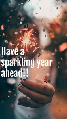 someone holding a sparkler in their hand with the words have a sparkling year ahead