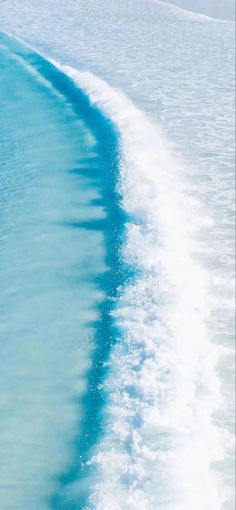 a man riding skis on top of a body of water next to a boat