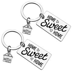 two keychains with the words home and sweet home on them, one has a house