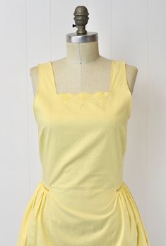 Classic Sleeveless Vintage Summer Dress, Classic Sleeveless Summer Vintage Dress, Mid-century Yellow Dresses For Spring, Fitted Yellow Vintage Dress For Summer, Mid-century Yellow Spring Dresses, Yellow Vintage Summer Dress For Daywear, Spring Yellow Vintage Dress For Daywear, Yellow Vintage Dress For Spring Daywear, Yellow Vintage Dress For Summer Daywear