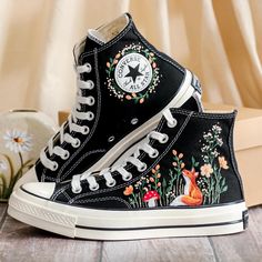 Custom Embroidered Converse High Tops 1970s, Fox Embroidered Converse Shoes, Fox and Flowers Embroidered Sneakers, Funny Halloween Gifts, Gift for Her 💚 Immerse yourself in the intricate craftsmanship as we lovingly hand embroider rustic flowers onto your chosen Converse pair 💚 🌿 The listed price encompasses both the Converse Shoes and the showcased Embroidery Designs. 1. MANUFACTURING PROCEDURE 🌿 Upon receiving your order, we initiate the shoe preparation process. If your chosen shoes are r Embroidery Shoes Pattern, Black High Top Converse Embroidery, Vintage High-top Embroidered Sneakers, Vintage Embroidered High-top Sneakers, Vintage Sneakers For Fall, Vintage Black Sneakers For Spring, Black Vintage Sneakers For Spring, Embroidered White Converse, Converse Designs Diy