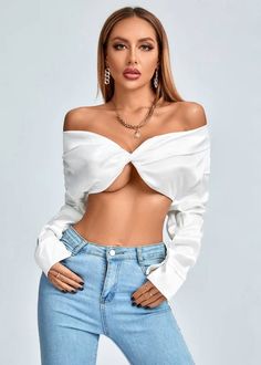 Stay fashionable and feel fabulous in this Twist Front Off Shoulder Long Sleeve Crop Top, crafted with luxurious satin material. This stylish top features an off shoulder neckline with twist front detail for an elegant and eye-catching silhouette. The long sleeves add an extra touch of sophistication, making it perfect for a night out or special occasion. Fabric: Polyester Chic Cropped Top With Twist Front, Chic Long Sleeve Top With Twist Front, Chic Long Sleeve Twist Front Top, Long Sleeve Twist Front Top For Night Out, Twist Front Long Sleeve Top For Night Out, Fitted Twist Front Top For Evening, Chic Evening Top With Twist Front, Elegant Long Sleeve Off-shoulder Top For Party, Elegant Long Sleeve Off-shoulder Party Top