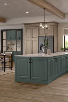 a large kitchen with an island in the middle and lots of cabinets on both sides