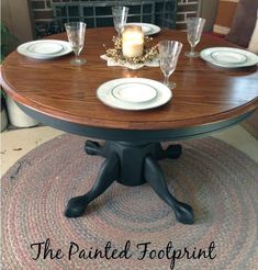 a table with plates and candles on it in front of a fire place mat that says the painted footprints