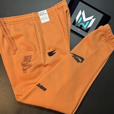 Nike Nsw Essentials Fleece Pants Men’s Sizes Orange Dm6871-808 Measurements Medium Waist: 33 Inches Inseam: 30 Inches Length: 40.5 Inches Large Waist: 34 Inches Inseam: 28.5 Inches Length: 40.5 Inches Nike Fall Streetwear Joggers, Nike Joggers With Pockets For Fall, Nike Streetwear Pants With Comfort Waistband, Nike Pants With Comfort Waistband For Streetwear, Nike Joggers With Pockets For Streetwear, Nike Fleece Pants With Side Pockets, Nike Bottoms For Streetwear In Fall, Nike Bottoms For Fall Streetwear, Nike Pants With Pockets For Fall