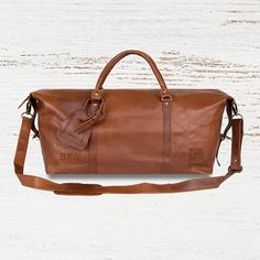 Hit the high seas or the boot of your car with our Armada Duffle in our flagship Vintage Brown Leather, inspired by the 16th-century Spanish sailing fleet. Shaped like a ships hull, this sturdy duffle bag comes complete with complimentary luggage tag and a hard base to protect its Leather Overnight Bag, Leather Holdall, Golf Gifts For Men, Overnight Bags, Leather Bags Handmade, Gifts For Brother, Gorgeous Bags, Overnight Bag, Grandpa Gifts