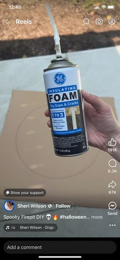 someone is holding up a spray of foam to show how it looks on the screen