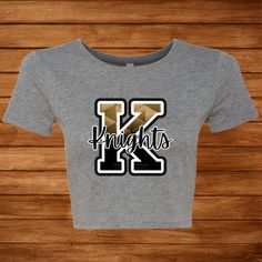 Bella + Canvas Form-fitting Crop 3.6 oz./yd² Airlume combed and ring-spun cotton/polyester, 40 singles Pre-shrunk XS/S or M/L Choose from 3 Different K designs. Casual Letter Print Cropped T-shirt For Sports, Cheerleading Short Sleeve T-shirt With Letter Print, College Tees, Ucf Knights, Cruise Shirt, School College, Fall Collections, Bella Canvas, Winter Collection