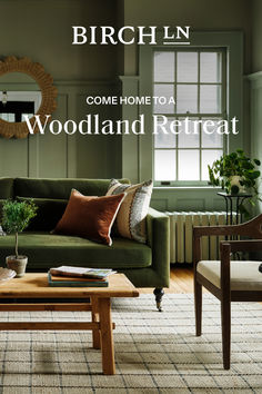 a living room with green couches and wooden coffee table in front of the window