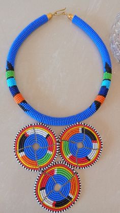 African Bush Blue Zulu Pendant Necklace, African Beaded Necklace, African Jewelry, Tribal Necklace, Gift For Her, Women Jewelry, GiftThis stunning beaded pendant necklace is elegantly crafted.Main Color - Bush Blue.Available is different colors.Wholesale available at a fair price.For any clarification please send me a convo or an e-mail.Thank you for visiting and Happy Shopping!!.. Blue Tiny Beads Round Jewelry, Blue Round Jewelry With Tiny Beads, Traditional Blue Necklaces With Tiny Beads, Traditional Blue Necklace With Tiny Beads, Blue Beaded Necklaces With Spacer Beads, Blue Beaded Round Necklaces, Blue Necklaces With Colorful Round Beads, Blue Beaded Necklaces With Colorful Beads, Blue Round Beaded Necklaces With Colorful Beads