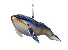 a dolphin ornament hanging from a chain