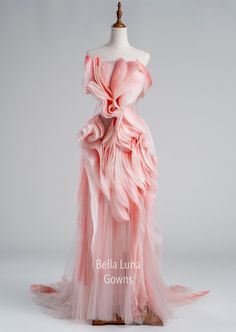 a dress on a mannequin with pink ruffles