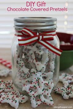 a jar filled with cookies and candy canes