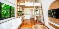 a living room filled with furniture and a ladder