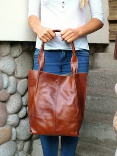 "Brown leather tote bag, brown Leather Handbag, Shoulder Bag, Leather Bag, Leather shopper, Every Day Bag, Women leather bag, Christmas Gift Tote Bag in brown, cognac, made of high-quality genuine Italian grain leather. A simple, classic model that works great for everyday days and as a gift. The bag has double handles to carry around the shoulder and hand. It is fastened with a magnet. Inside there is a zippered pocket. A casual model that will suit any style of clothing. A capacious and origin Cognac Tote Hobo Bag With Leather Handles, Cognac Leather Tote Shoulder Bag, Cognac Tote Shoulder Bag With Leather Handles, Cognac Leather Bag, Cognac Bag, Large Leather Purse, Dark Tan Leather-lined Tote Bag, Cognac Shoulder Tote Bag With Gold-tone Hardware, Slouchy Tote