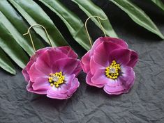 Exquisite Magenta Silk Pansy Hoop Earrings, the perfect accessory to add a touch of elegance and femininity to any outfit. Inspired by the beauty of spring flowers, these earrings are crafted with delicate silk petals in shades of blue that perfectly mimic the charming pansy blooms. Designed to be versatile and timeless, these earrings come in a classic hoop shape that's perfect for any occasion. Whether you're looking to add a pop of color to your everyday wardrobe or searching for something blue to complete your bridal look, these Blue Silk Pansy Hoop Earrings are the perfect choice. Made with high-quality materials, these earrings are both durable and lightweight, making them comfortable to wear all day long. They're the perfect accessory for women and girls of all ages, adding a touch Girl Graduation, Outfit Inspired, Spring Flower, Flower Jewelry, Blue Silk, Something Blue, Flower Jewellery, Everyday Wardrobe, Pansies