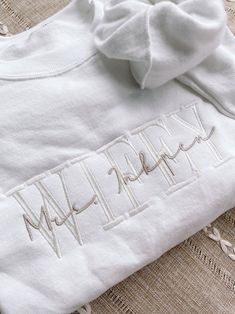 Personalized Wifey with Mrs. name Gift! Perfect for a new bride or anniversary gift! White Long Sleeve Top With Custom Embroidery, White Long Sleeve T-shirt With Embroidered Text, White Crew Neck Sweatshirt With Letter Embroidery, White Cotton Sweatshirt With Embroidered Text, White Crew Neck Tops With Machine Embroidery, White Cotton Sweatshirt With Custom Embroidery, White Crew Neck Top With Embroidered Text, White Cotton Tops With Letter Embroidery, Wife Sweatshirt