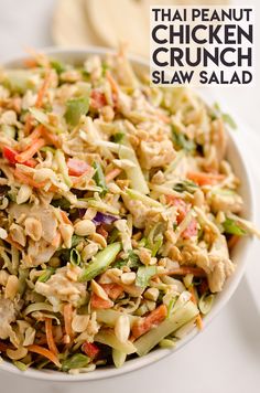 a white bowl filled with coleslaw and carrots on top of a table