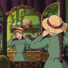 two women in green dresses and hats looking at each other's faces while standing in front of a mirror